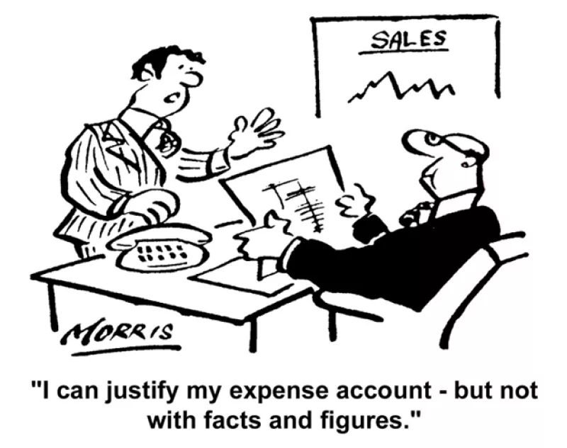 A salesman wearing a suit is standing in front of a desk has his  hand in the air as if explaining something to a man, also wearing a suit, sitting behind the desk reading an expense report. 